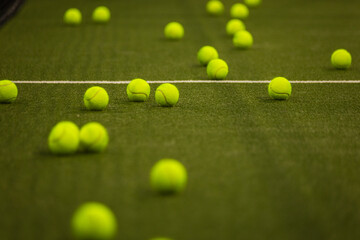 Padel balls on court during sunny day, clean and minimalistic image for sports websites, blogs, and...