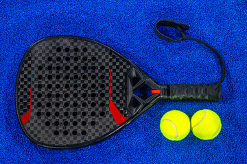 Padel tennis racket. Background with copy space. Sport court and ball