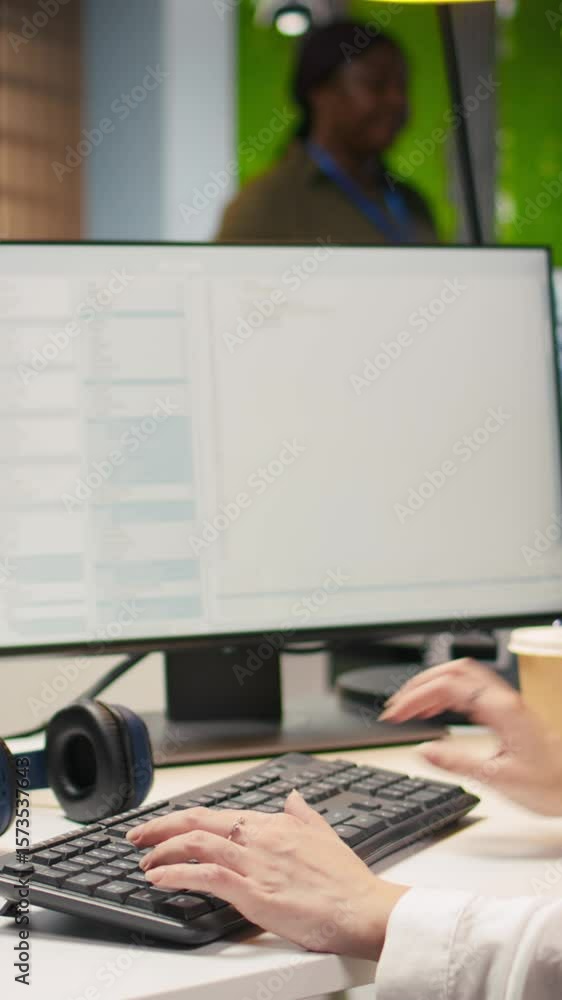 Poster vertical video close up of it expert coding with ai language model assistance in startup office, usi