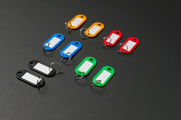 Colorful Key Tags on Dark Surface