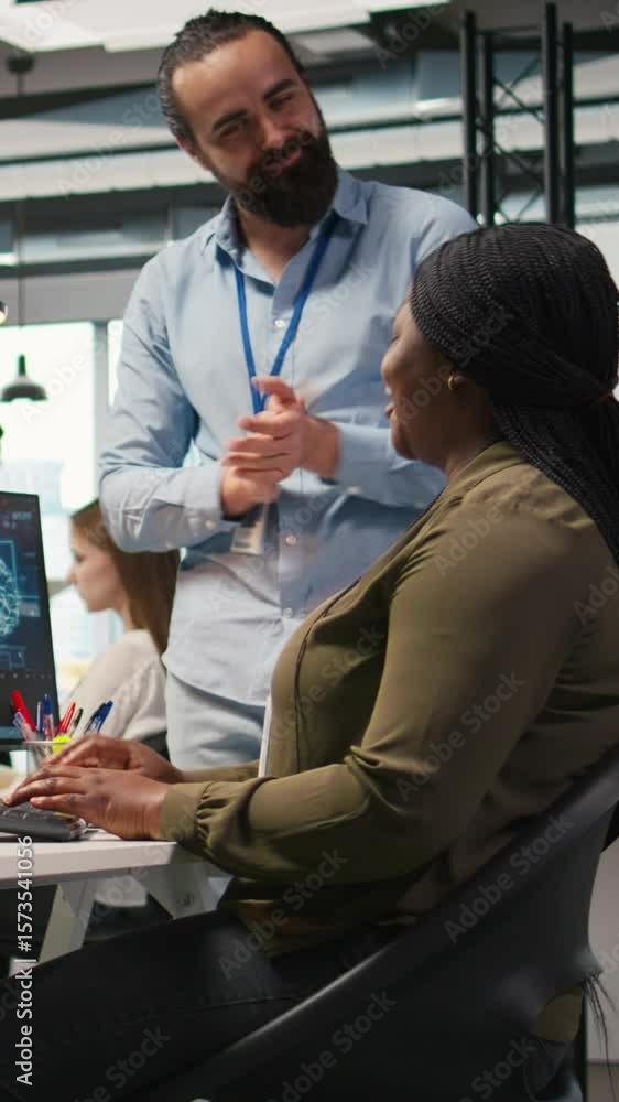 Poster vertical video pleased startup office manager applauding female programmer for optimizing code using