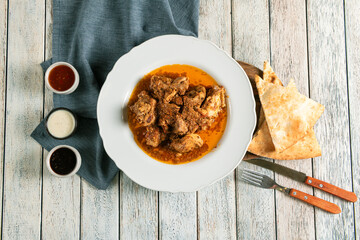 Tasty Chicken Curry With Flatbread & Sauces