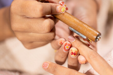 Nail art beauty treatment at home nail salon with floral fashion design on fingernails creating stylish and elegant look for personal care and self expression
