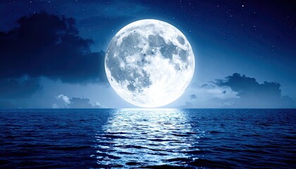 Full moon over calm ocean at night