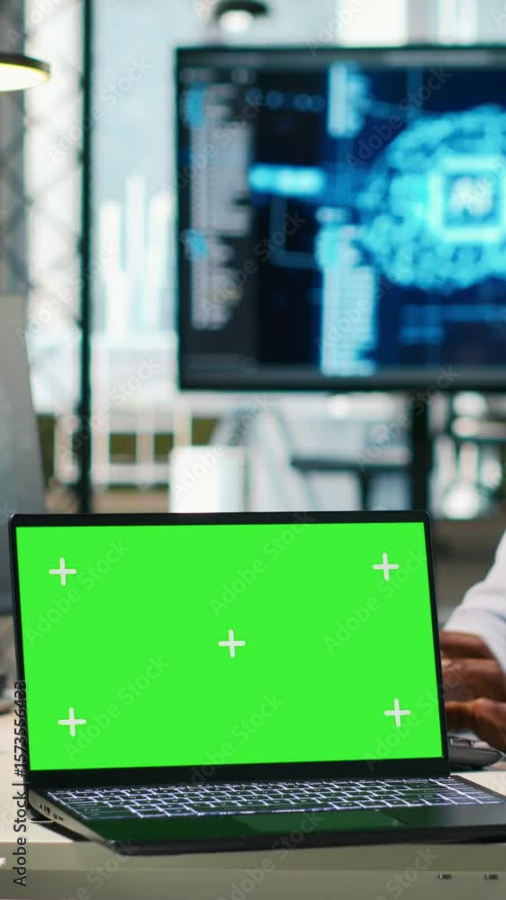 Poster vertical video startup office programmer using green screen laptop, developing artificial intelligen