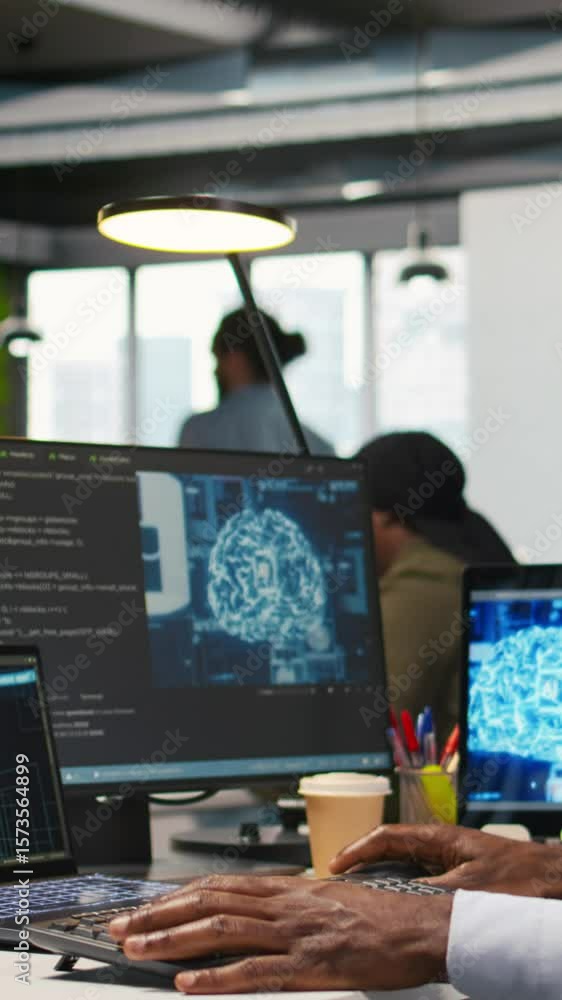 Poster vertical video computer scientist in office integrating ai machine learning systems to streamline wo