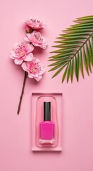 Pink nail polish bottle with cherry blossoms and green leaf on pink background