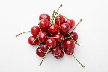 Pile of fresh ripe cherries on white background, top view