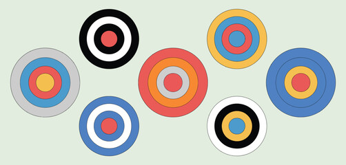 Collection of colorful concentric circle targets arranged on a light green background