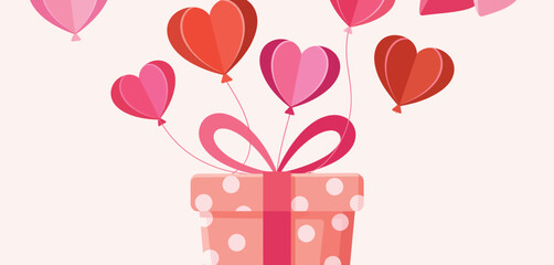Pink and red heart shaped balloons floating above a polka dot gift box