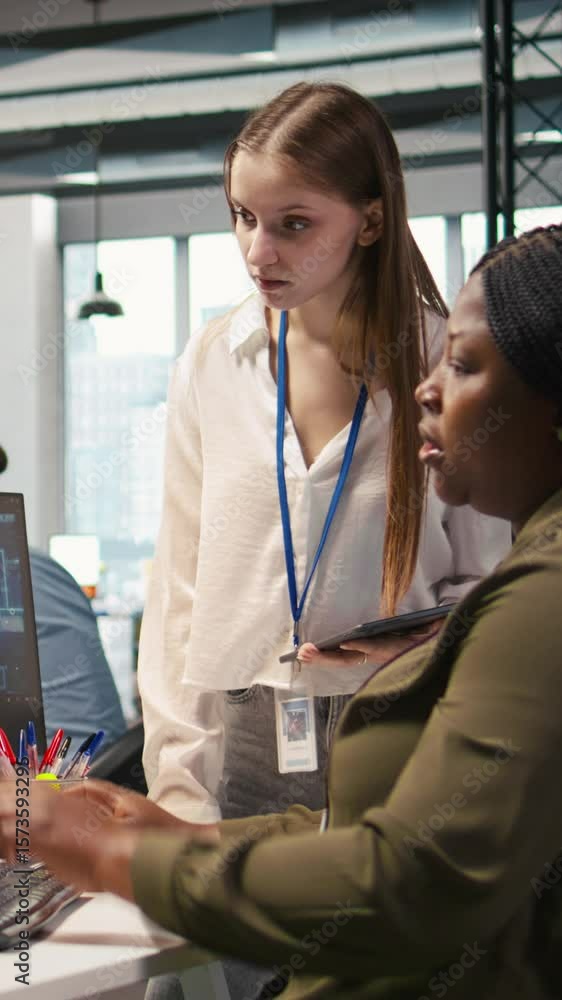 Poster vertical video manager teaching young technician how to develop software and optimize code using ai.