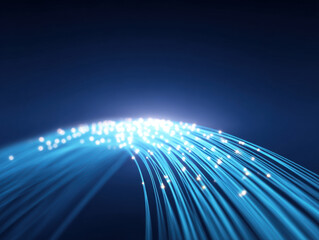 Fiber optic cable with glowing blue light strands representing high speed data transmission and modern technology network connection