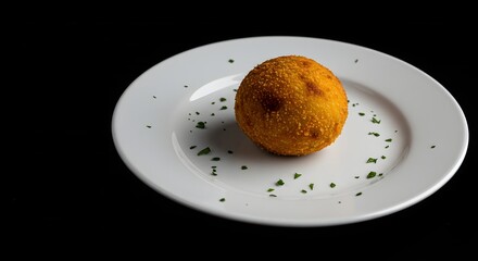 Golden Fried Arancini Rice Ball Appetizer Garnished with Fresh Herbs on a White Plate