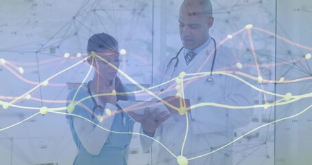 Doctors entering hospital carrying tablet tapping screen revealing data overlay for diagnosis - Powered by Adobe