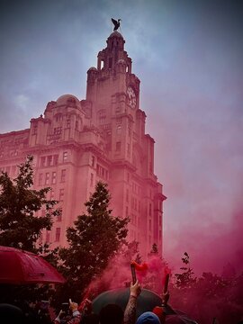 Liverpool Football Club Fans Celebrate with Red Smoke Flares at the Royal Liver Building, UK