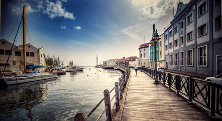 Woman strolls down the Boardwalk in Bridgetown Barbados