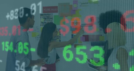 woman tapping swatch initiating stock numbers scrolling on design board for real-time market data - Powered by Adobe