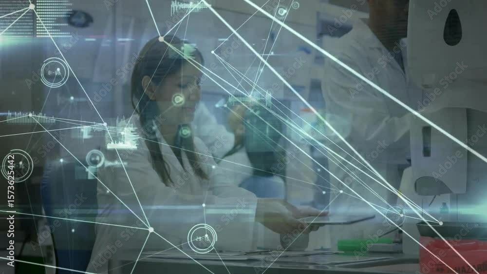 Poster lab scientist tapping tablet under overlay to start scan and colleague monitoring
