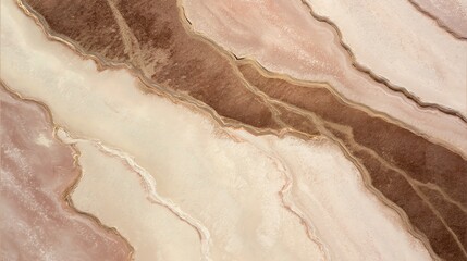 A close-up image of natural marble patterns with wavy layers in various shades of beige, brown, and cream.