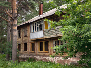 An old two-story wooden abandoned derelict building slated for demolition