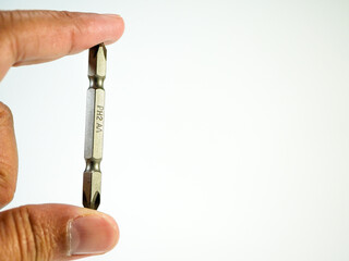 Holding a phillips head screwdriver bit, hardware tool for construction and do it yourself projects...