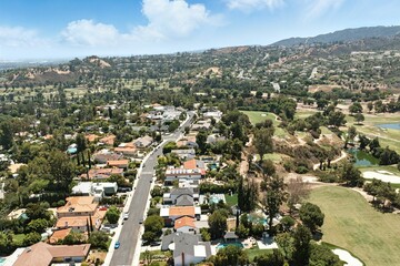 Scenic Aerial of Suburbia and Golf Greens