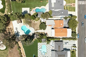 Overhead View of Suburban Homes with Pools