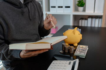 a man is calculating the money from his savings account to buy a house, this man is calculating his...