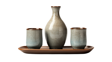 Still life of sake bottle and two cups on a wooden tray against a transparent background studio shot