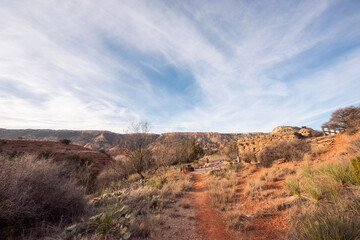 Full color wide landscape view of the scenic canyons and desert scenery while exploring Palo Duro Canyon on a trip west