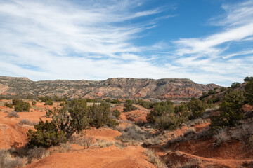 Full color wide landscape view of the scenic canyons and desert scenery while exploring Palo Duro Canyon on a trip west