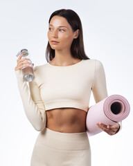 Fit Woman With Yoga Mat And Water Bottle For Wellness And Hydration Concept