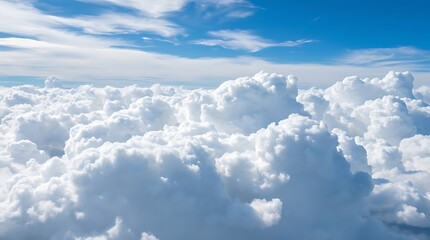 Clouds in the blue sky as seen through window of an aircraft.