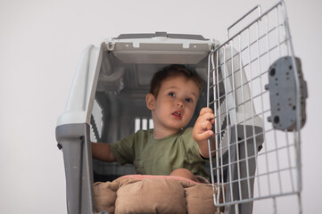 A small child in a closed cage.