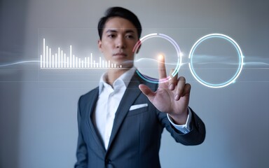 Asian Businessman Interacting with Digital Interface Displaying Data and Circular Graphics