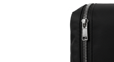 Close up Texture of Black Fabric with Metallic Zipper Detail Isolated