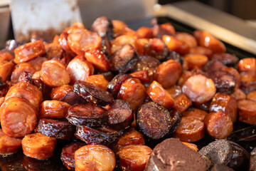 Sausages cooking in a pan. Animal protein.