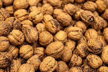 Numerous unshelled walnuts are available on the market. Dried fruits shaped like brains.