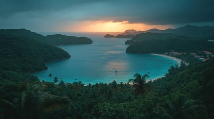 Coastal paradise at sunset. Lush green hills meet turquoise bay.  Tranquil scene