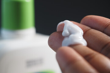 Applying moisturizing cream on hand