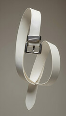 Stylish White Belt Suspended in Mid-air with Silver Buckle