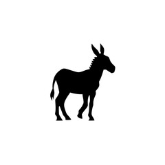 Fototapeta premium Silhouette of a donkey standing with its ears perked up and tail slightly raised in a side profile view