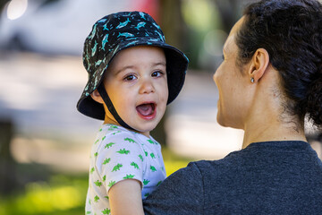 Smiling Boy Toddler Wearing a Hat Outdoors in Vancouver, BC, Canada