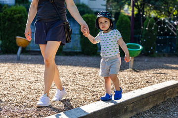 Young Boy and Parent Enjoying Vancouver Park in Summer Outdoors