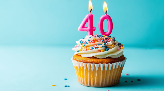 Cupcake to celebrate birthdays or anniversary with white sprinkles decorated with pink candles number 40