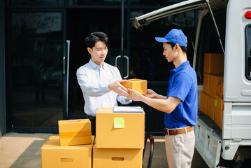 Delivery Asian man by sending box of parcel to customers service at home