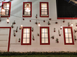 High walls with several glass windows. Textured Backgrounds. House walls with six rectangular windows decorating the walls. Exterior design and decoration. Unique house design with copy space.