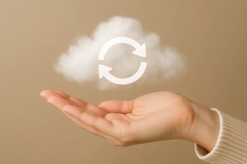 A hand gently holds a fluffy white cloud with a circular refresh symbol, representing data and cloud computing