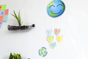 Arrangement Of Handmade Eco Themed Art And Hanging Plant Pots