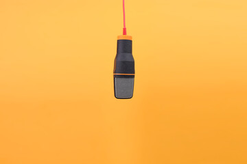Studio Microphone For Recording Podcast Or Singing Isolated On Yellow Background